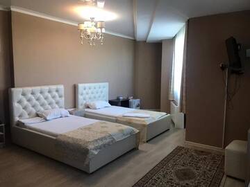 Фото номера Двухместный номер с 2 отдельными кроватями Отель Royal M г. Нур-Султан 10