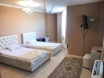 Фото номера Двухместный номер с 2 отдельными кроватями Отель Royal M г. Нур-Султан 13
