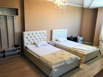 Фото номера Двухместный номер с 2 отдельными кроватями Отель Royal M г. Нур-Султан 11