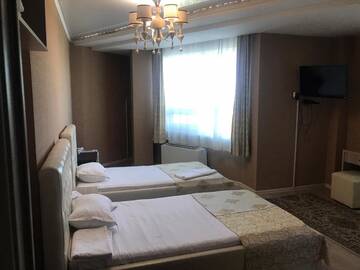 Фото номера Двухместный номер с 2 отдельными кроватями Отель Royal M г. Нур-Султан 2