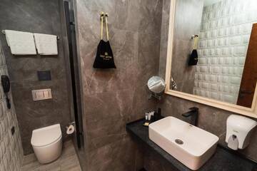 Фото номера Улучшенный двухместный номер с 2 отдельными кроватями Отель East Astana Hotel г. Нур-Султан 20