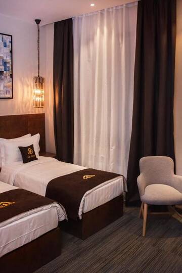 Фото номера Улучшенный двухместный номер с 2 отдельными кроватями Отель East Astana Hotel г. Нур-Султан 28