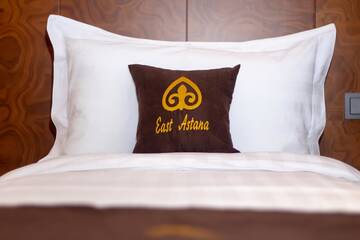 Фото номера Улучшенный двухместный номер с 2 отдельными кроватями Отель East Astana Hotel г. Нур-Султан 4