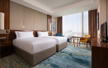 Фото номера Двухместный номер с 2 отдельными кроватями Отель Hilton Astana г. Нур-Султан 3
