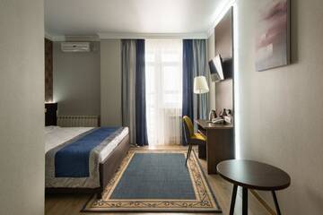 Фото номера Двухместный номер с 1 кроватью и балконом Отель NCityHotel г. Нур-Султан 7