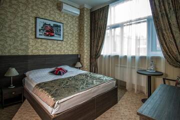 Фото номера Номер Делюкс с кроватью размера «king-size» Отель Бутик-отель Seven inn г. Нур-Султан 3