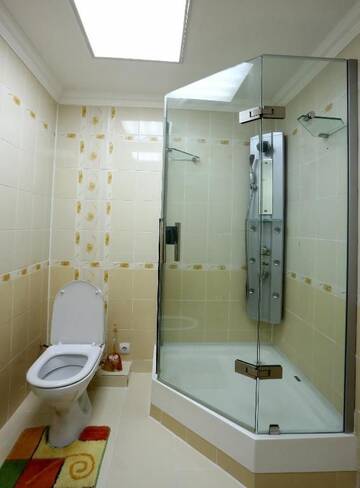 Фото номера Апартаменты с 2 спальнями Апартаменты Sunrise Apartments Triumph г. Нур-Султан 32